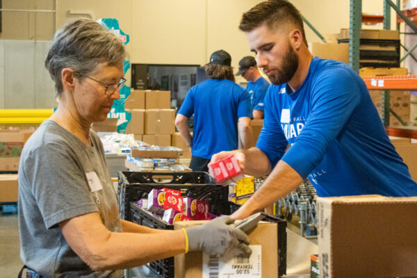 Photos gathered on May 24th, 2023. Sioux Falls Canaries players assists in packaging food boxes with the Feeding South Dakota team.